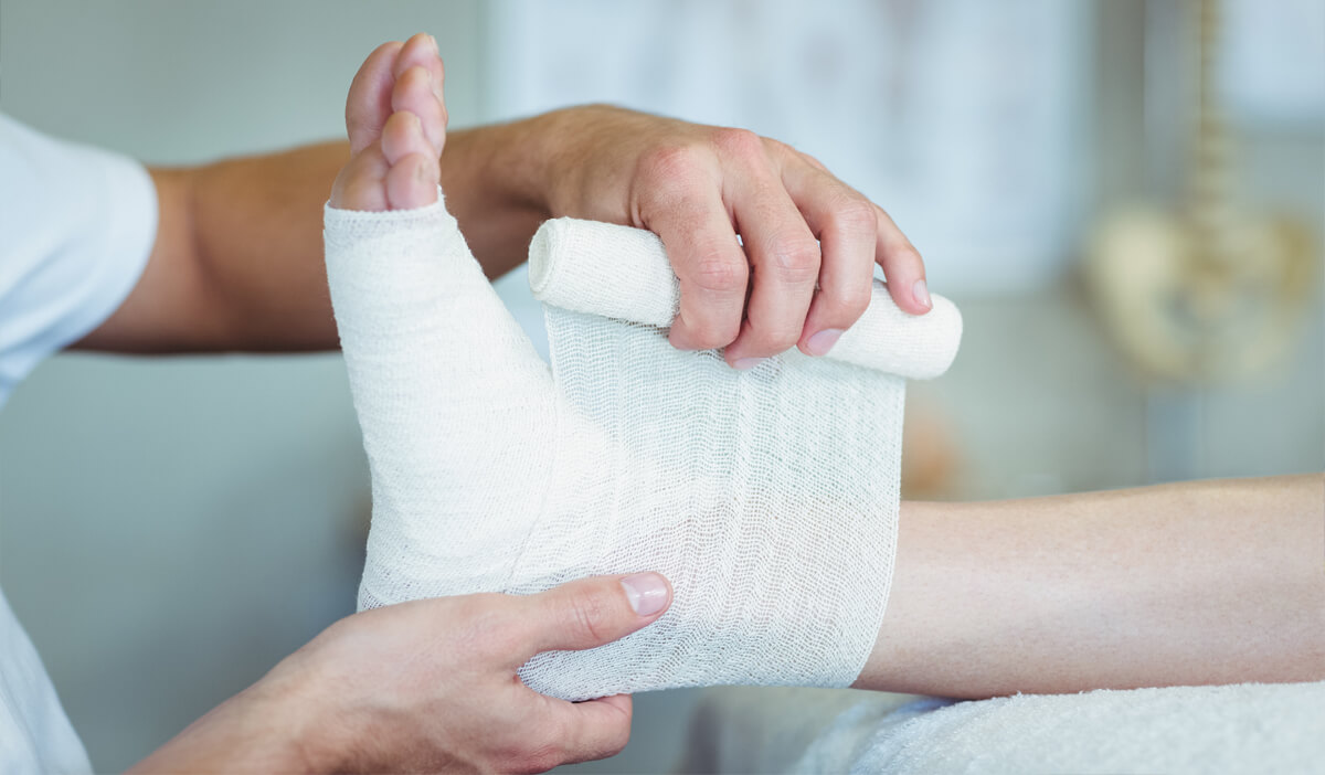 Wound care specialist bandages a wound that won't heal