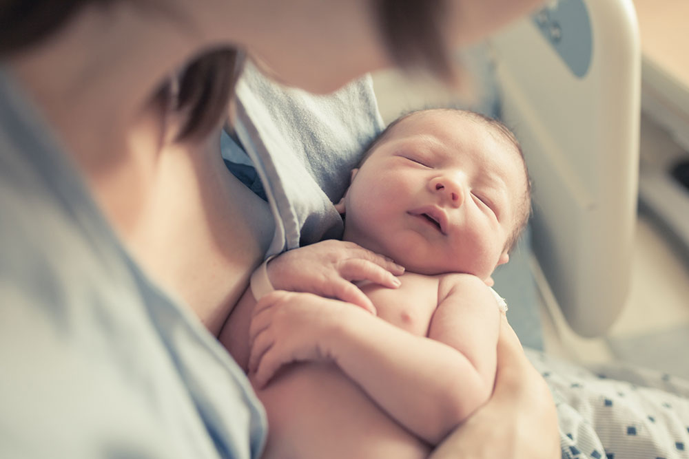 mother holding infant