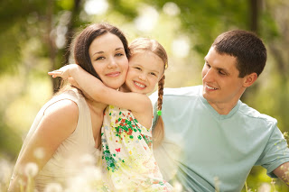 mom-to-be with her daughter and husband