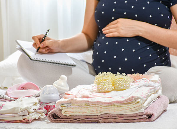 pregnant woman packing for the hospital