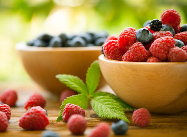 Two bowls of berries