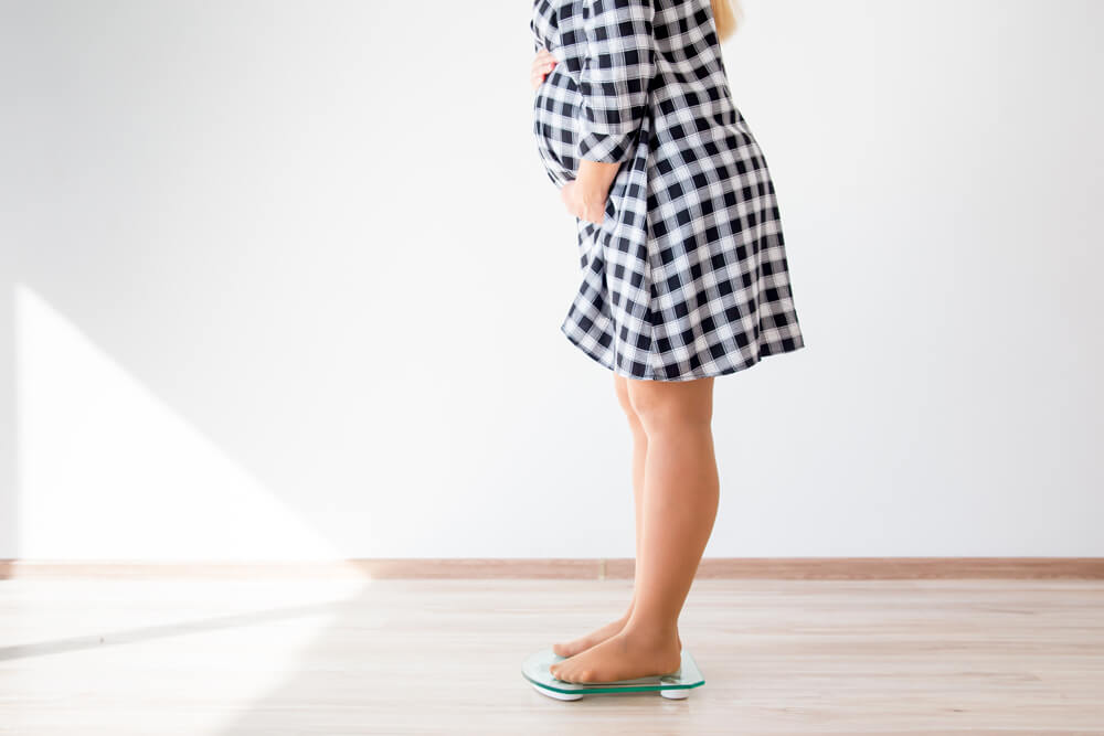 a pregnant woman keeping track of her weight