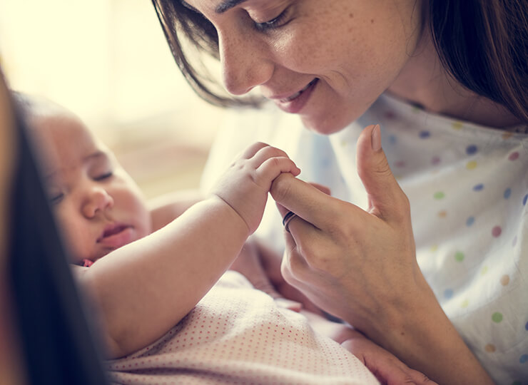 mom holding baby