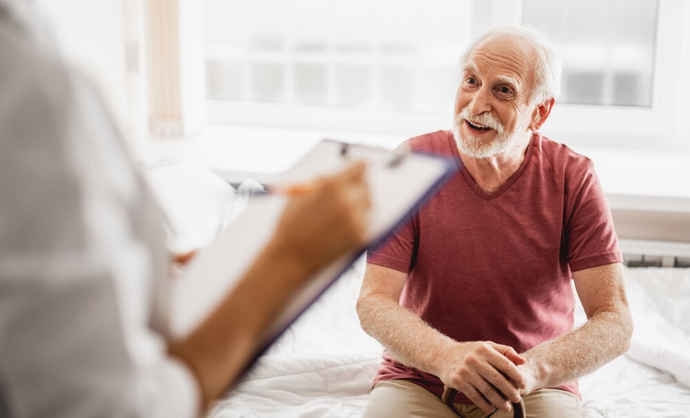 older patient talking to a doctor