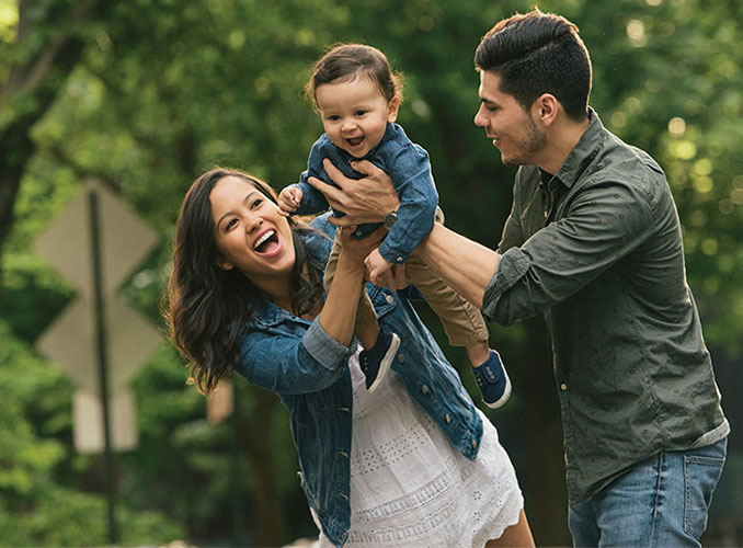 Young family playing outside