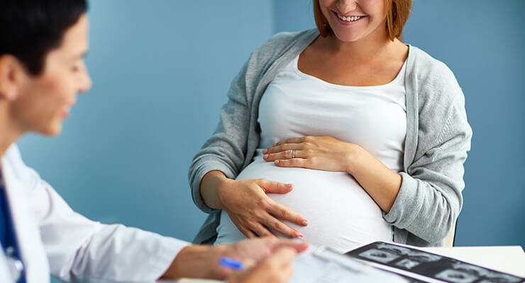 pregnant woman with doctor