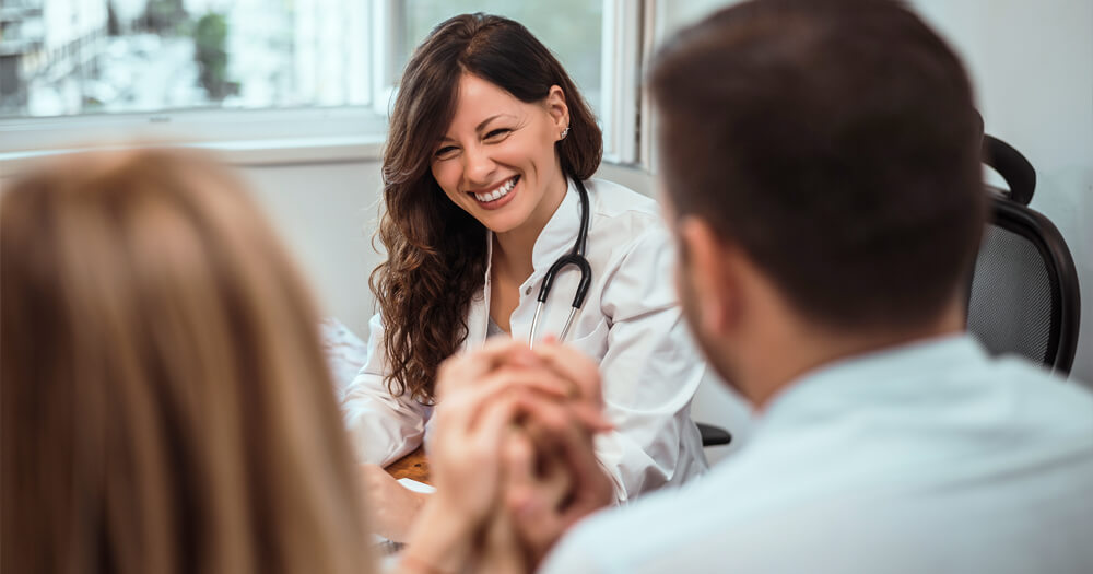 couple meeting with obstetrician